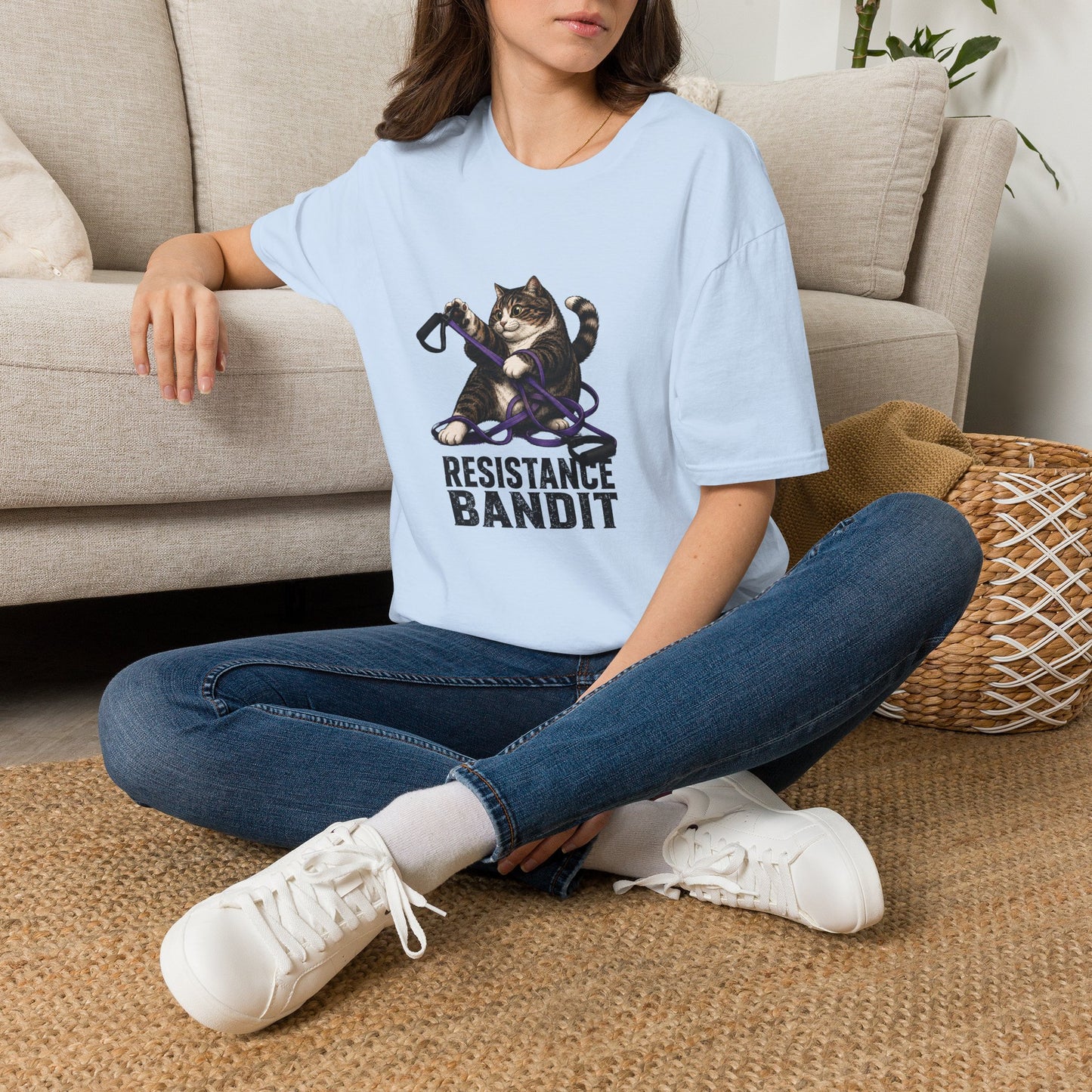 Resistance Bandit cat t-shirt, funny fitness cat with exercise resistance band illustration, light blue